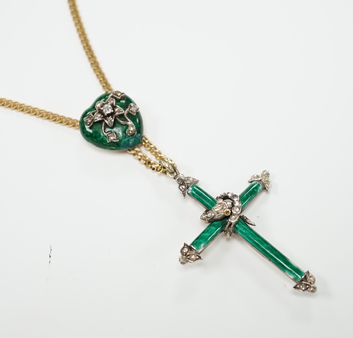 A 19th century yellow metal, green enamel and rose cut diamond set cross pendant, with entwined serpent and heart shaped slider, now on a later Italian 9ct gold chain, overall 58cm, gross weight 16.5 grams.